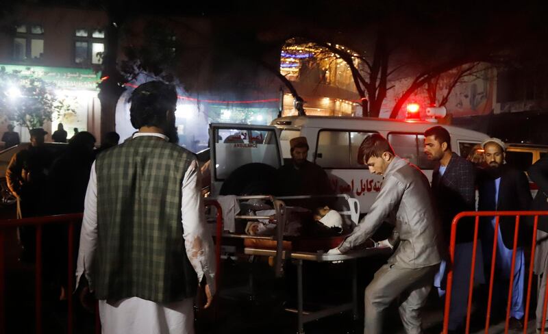 epa07179579 Afghan health workers carry an injured person outside the Emergency hospital after a suicide attack targeted a wedding hall, in Kabul, Afghanistan, 20 November 2018. According to the health ministry of Afghanistan at least 40 killed people were killed and 60 others were wounded.  EPA/JAWAD JALALI