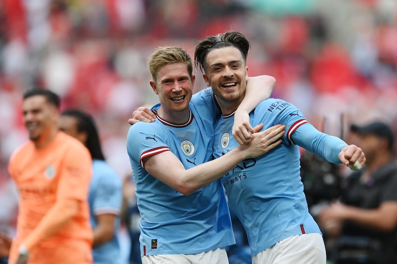 Jack Grealish, right, with Kevin De Bruyne after Manchester City won the FA Cup at Wembley Stadium. Getty