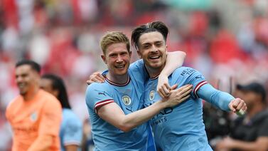 Jack Grealish, right, with Kevin De Bruyne after Manchester City won the FA Cup at Wembley Stadium. Getty