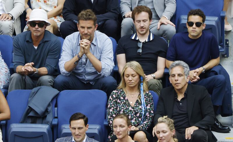 US actors Brad Pitt, top left,  Bradley Cooper, Rami Malek, Christine Taylor, front left, and Ben Stiller watch Daniil Medvedev of Russia play Novak Djokovic of Serbia. EPA