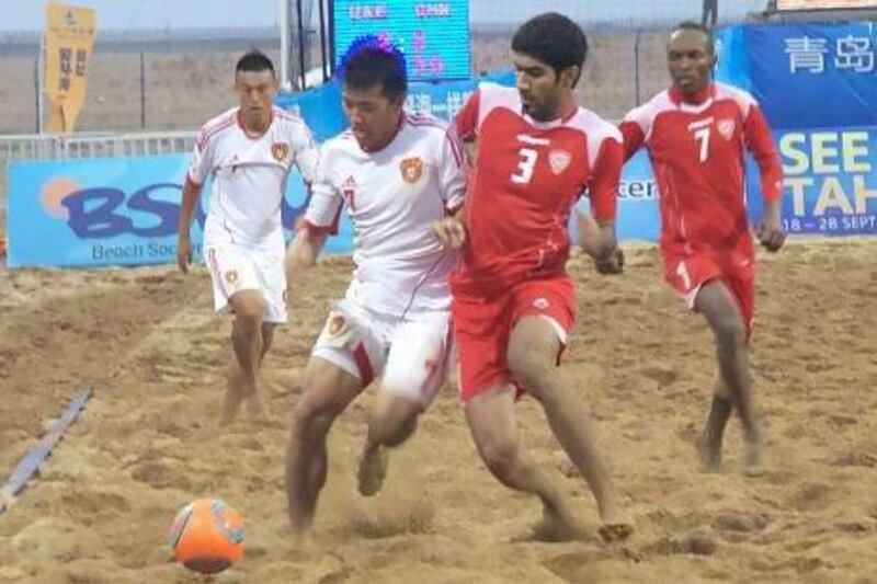 The host Chinese National Team claimed the Asian Beach Soccer Cup after edging the UAE, in red, in the penalty kick shoot out.