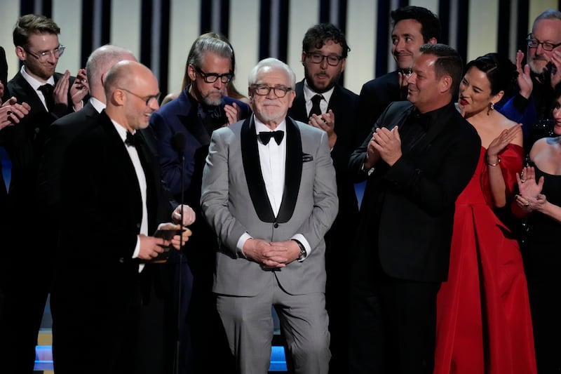 Jesse Armstrong and the cast and crew of Succession clap for series star Brian Cox. AP