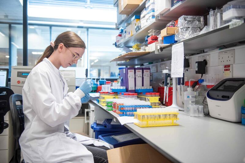 (FILES) An undated handout picture released by the University of Oxford on November 23, 2020 shows a technician working on the University's COVID-19 candidate vaccine, known as AZD1222, co-invented by the University of Oxford and Vaccitech in partnership with pharmaceutical giant AstraZeneca.  Britain on December 30, 2020 became the first country in the world to approve the coronavirus vaccine developed by drug firm AstraZeneca and Oxford University, with a mass rollout planned from January 4, 2021. - RESTRICTED TO EDITORIAL USE - MANDATORY CREDIT "AFP PHOTO / UNIVERSITY OF OXFORD / John Cairns " - NO MARKETING - NO ADVERTISING CAMPAIGNS - RESTRICTED TO ILLUSTRATING STORIES RELATED TO THE PARTICULAR VACCINE, EVENTS AND FACTS MENTIONED IN THE CAPTION - DISTRIBUTED AS A SERVICE TO CLIENTS 
 / AFP / University of Oxford / University of Oxford / John Cairns / RESTRICTED TO EDITORIAL USE - MANDATORY CREDIT "AFP PHOTO / UNIVERSITY OF OXFORD / John Cairns " - NO MARKETING - NO ADVERTISING CAMPAIGNS - RESTRICTED TO ILLUSTRATING STORIES RELATED TO THE PARTICULAR VACCINE, EVENTS AND FACTS MENTIONED IN THE CAPTION - DISTRIBUTED AS A SERVICE TO CLIENTS 
