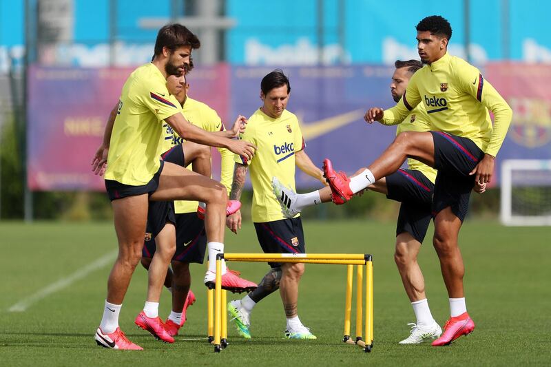 Lionel Messi, Jordi Alba, Junior Firpo, right, Arturo Vidal and Gerard Pique, left, during a training session in Barcelona. Getty Images