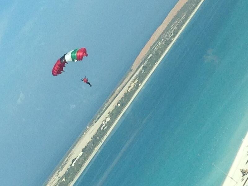 People on Abu Dhabi's Corniche were treated to a spectacle this morning as parachuting daredevils swooped in for a National Day celebration. Kristina Armstrong