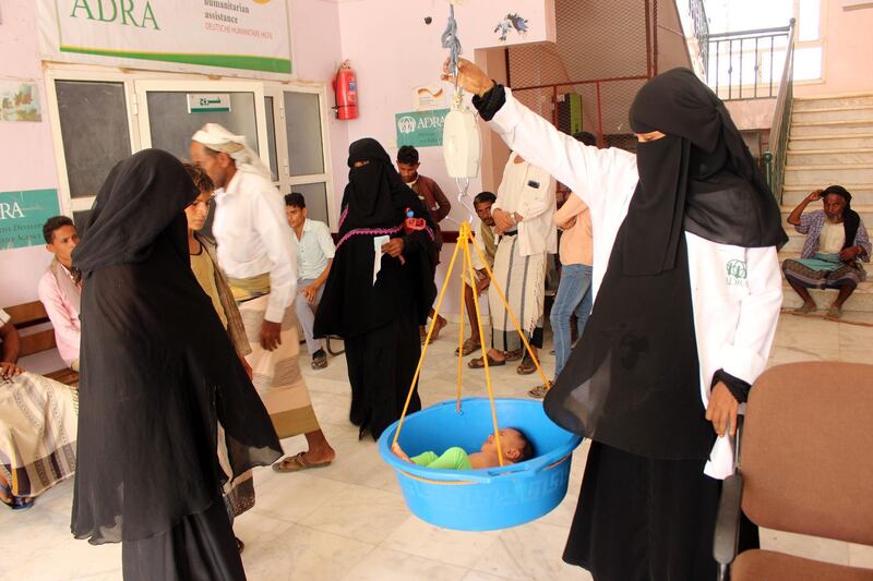 A malnourished Yemeni toddler is weighed at a clinic run by a humanitarian organisation in the port city of Hodeida. AFP