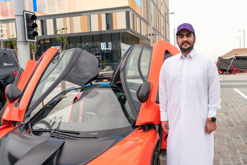 Talal Al Thani poses with one of his fancy cars 