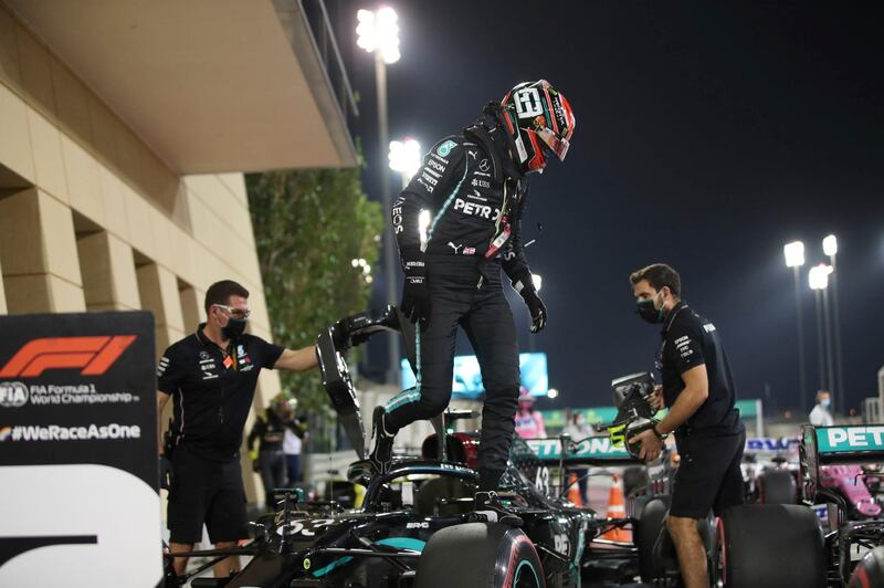 Mercedes driver Valtteri Bottas of Finland, who earned pole position, steps out of his car after the qualifying for the Bahrain Formula One Grand Prix, at the Formula One Bahrain International Circuit in Sakhir, Bahrain, Saturday, Dec. 5, 2020. The Bahrain Formula One Grand Prix will take place on Sunday. (Tolga Bozoglu, Pool via AP)