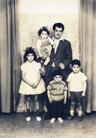 Zineb Sedira in her father's arms with sister Farida and brothers Djamel and Boualem in Gennevilliers, France. Photo: Zineb Sedira