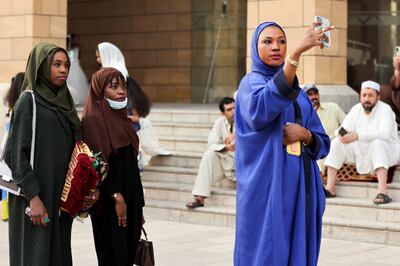 Women take a selfie during Eid Al Fitr celebrations at the King Abdul Aziz Mosque in Riyadh on May 2, 2022.  Reuters