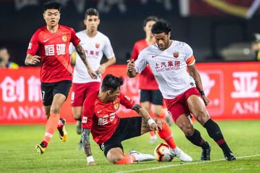 Shanghai SIPG, in white, Guangzhou Evergrande, red, are two of four Chinese representatives in this year's Asian Champions League. AFP