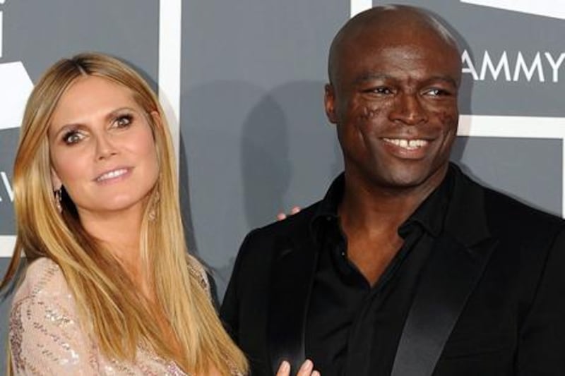 The musician Seal and his wife, model Heidi Klum, at the Grammy Awards in Los Angeles in 2010. Gabriel Bouys / AFP