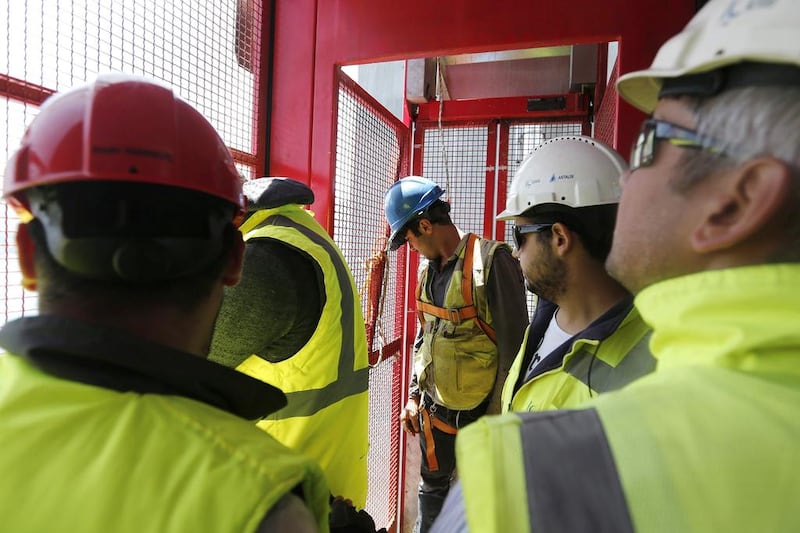 Construction workers perform their duties at the construction site of the Yavuz Sultan Selim Bridge. Sedat Suna / EPA