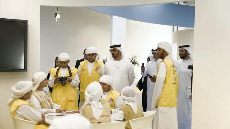 Hussain bin Ibrahim Al Hammadi, minister of education with pupils in Ajman. Reem Mohammed / The National