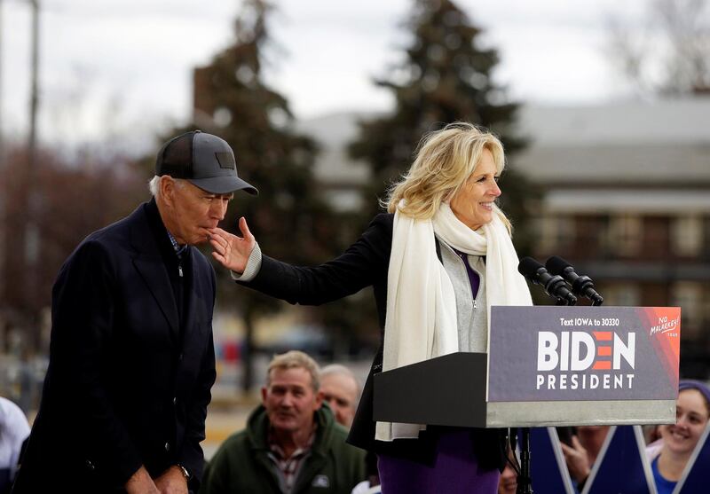 COUNCIL BLUFFS, IA - NOVEMBER 30: Democratic presidential candidate, former Vice President Joe Biden bites the finger of his wife Jill Biden as she introduces him during a campaign event on November 30, 2019 in Council Bluffs, Iowa. Biden, who begins his eight-day bus tour across Iowa on Saturday, once lead the state in the polls but now trails presidential candidates Pete Buttigieg and Elizabeth Warren with just under 3 months until the 2020 Iowa Democratic caucuses. (Photo by Joshua Lott/Getty Images)