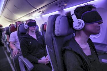 Passengers tune-in to a guided meditatation on a Virgin Australia flight. Courtesy Virgin Australia  