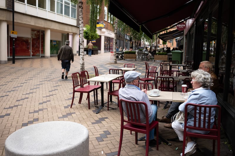 A couple sit outside a coffee shop in Wakefield town centre ahead of the by-election. Getty Images