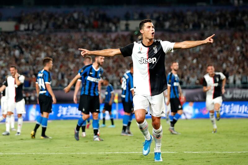 NANJING, CHINA - JULY 24: Cristiano Ronaldo of Juventus celebrates scoring his side's first goal from a free kick during the International Champions Cup match between Juventus and FC Internazionale at the Nanjing Olympic Center Stadium on July 24, 2019 in Nanjing, China. (Photo by Fred Lee/Getty Images)