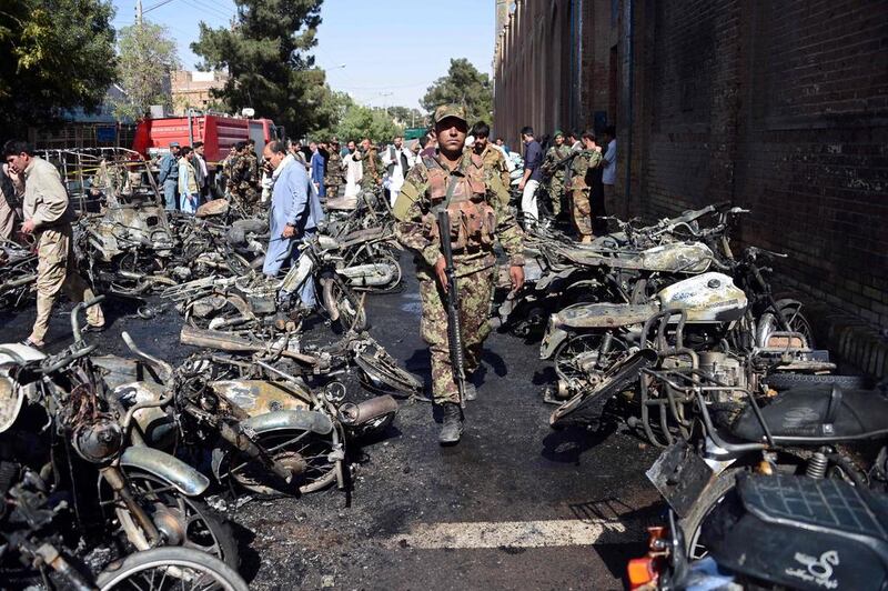 Afghan security personnel arrive at the site of a motorcycle bomb explosion in front of the Jami Mosque in Herat on June 6, 2017. AFP / HOSHANG HASHIMI

