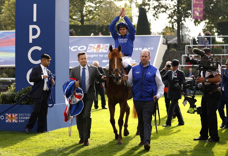 Jockey William Buick celebrates with Creative Force after winning the Champions Sprint Stakes. PA