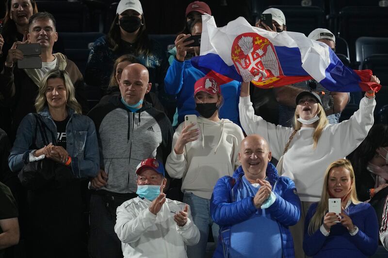 Novak Djokovic fans celebrate after he beat Lorenzo Musetti at the Dubai Duty Free Tennis Championships. AP