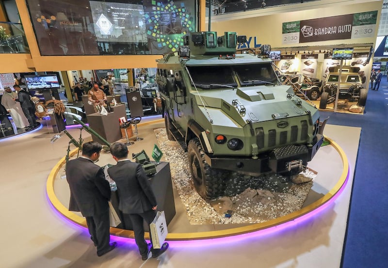 Abu Dhabi, U.A.E., February 20, 2019. INTERNATIONAL DEFENCE EXHIBITION AND CONFERENCE  2019 (IDEX) Day 4--  Visitors look at the military vehicles at the Saudi Arabia area stands..
Victor Besa/The National
Section:  NA