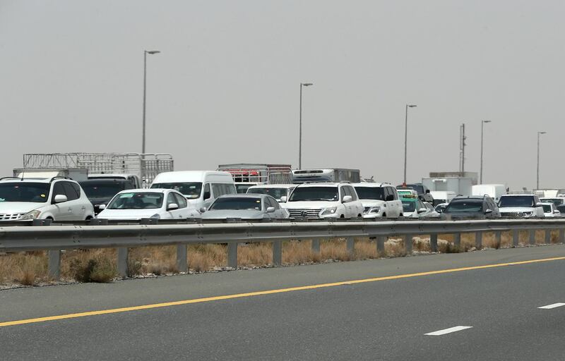 DUBAI, UNITED ARAB EMIRATES , July 15 – 2020 :- Traffic jam at the Dubai border going towards Abu Dhabi on Sheikh Zayed road in Dubai. (Pawan Singh / The National) For News/Online