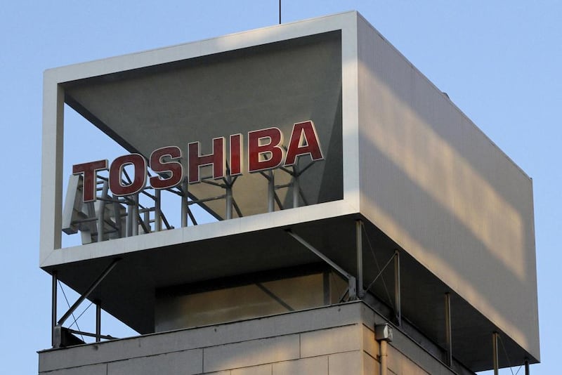 A Toshiba logo on the company headquarters in Tokyo. The company is expected to announce its huge writedown today. Shohei Miyano / Reuters