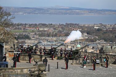 Members of the 105th Regiment Royal Artillery fire a 41-round gun salute at Edinburgh Castle, Scotland, on Saturday, to mark the death of the Duke of Edinburgh. Getty