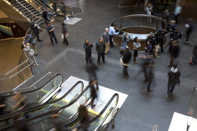 Commuters move through the new Fulton Center. Andrew Gombert / EPA