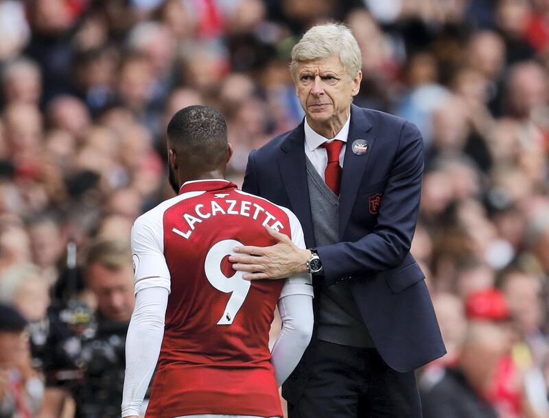 Soccer Football - Premier League - Arsenal vs Brighton & Hove Albion - Emirates Stadium, London, Britain - October 1, 2017   Arsenal's Alexandre Lacazette is congratulated by manager Arsene Wenger as he walks off to be substituted     REUTERS/Eddie Keogh  EDITORIAL USE ONLY. No use with unauthorized audio, video, data, fixture lists, club/league logos or "live" services. Online in-match use limited to 75 images, no video emulation. No use in betting, games or single club/league/player publications. Please contact your account representative for further details. - RC15DCD48D10