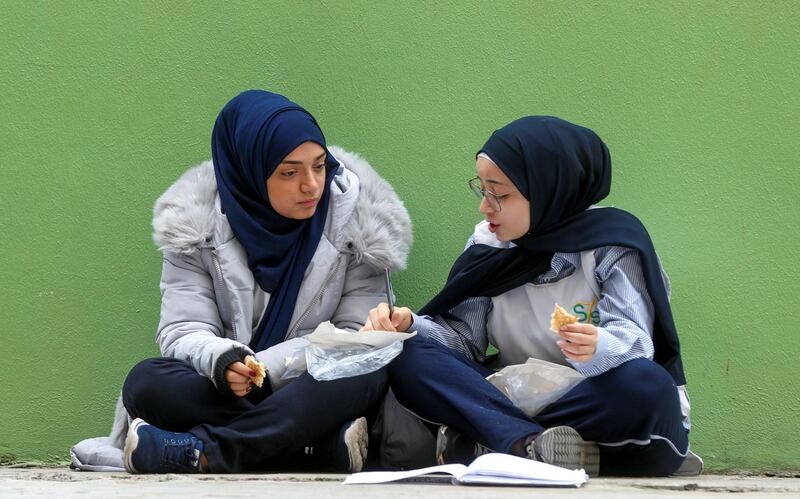 Students sit together during recess at a public school in Beirut, Lebanon December 12, 2019. Reuters