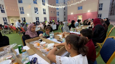 Palestinians gather for iftar at Emirates Humanitarian City. Wajod Alkhamis / The National