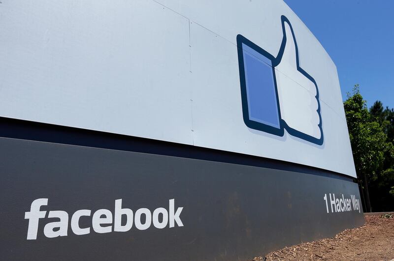 FILE - This July 16, 2013, file photo, shows a sign at Facebook headquarters in Menlo Park, Calif. The Boston-based renewable energy developer Longroad Energy announced in May 2019 that Facebook is building a massive new solar farm in West Texas, a project believed to be one of the largest in the nation and the social media giant's first direct investment in renewable energy. (AP Photo/Ben Margot, File)