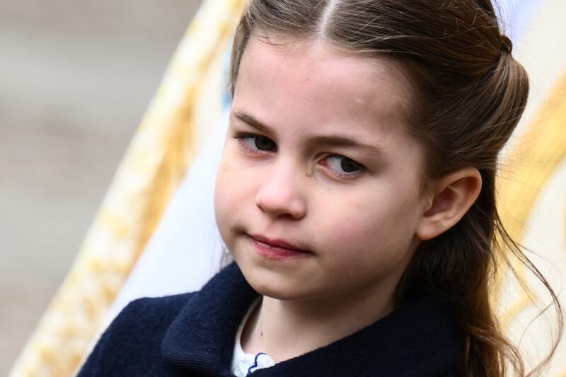 Britain's Princess Charlotte leaves the service for Prince Philip. AFP