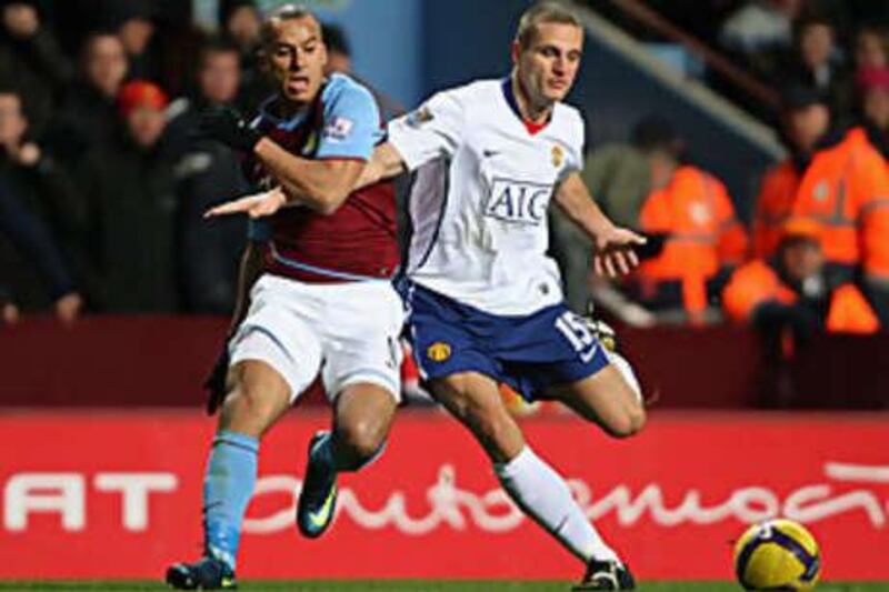 Gabriel Agbonlahor, left, is barged off the ball by United's Nemanja Vidic in their 0-0 draw at Villa Park.