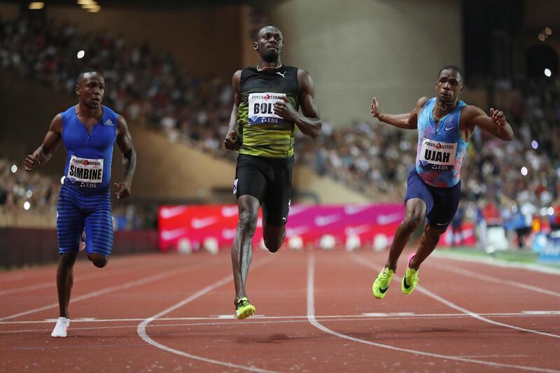 Jamaica's Usain Bolt, centre, crosses the finish line to win the men's 100m event at the IAAF Diamond League athletics meeting in Monaco on July 21. Valery Hache / AFP