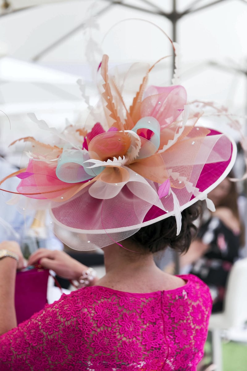 DUBAI, UNITED ARAB EMIRATES - MARCH 31, 2018. 

A woman wears a floral hat at Dubai World Cup 2018.

(Photo by Reem Mohammed/The National)

Reporter: 
Section: NA