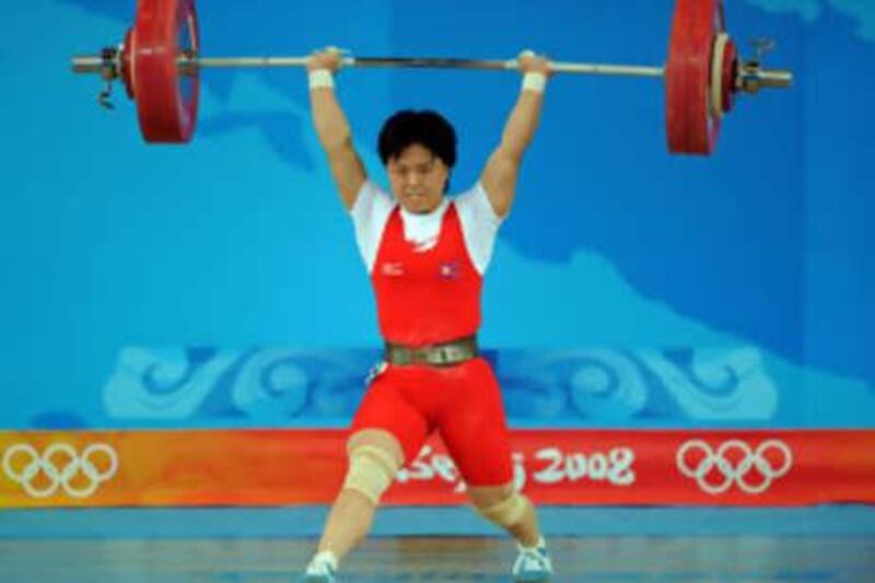 Pak Hyon Suk of North Korea one her way to gold in the women's 63 kg weightlifting.