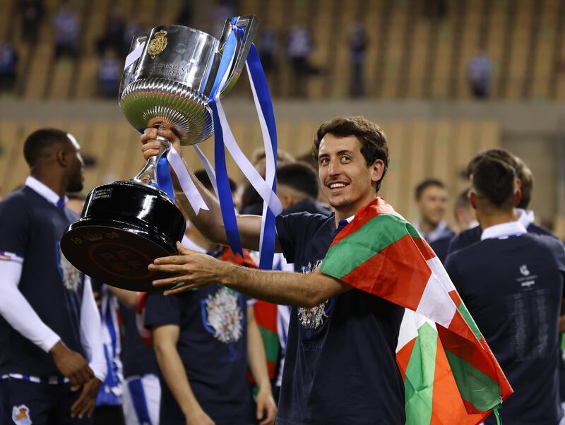 Real Sociedad's Mikel Oyarzabal celebrates winning the Copa del Rey with the trophy. Reuters