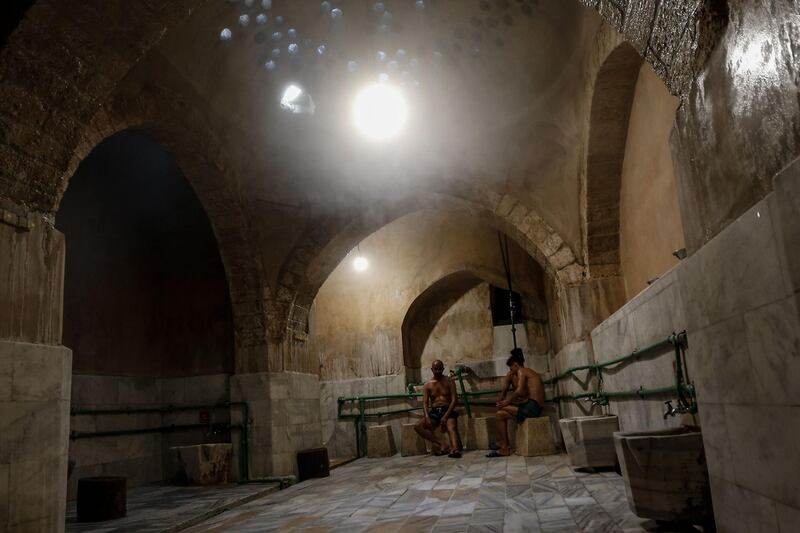 Palestinian men relax at the ancient Turkish steam bath in Gaza. AFP