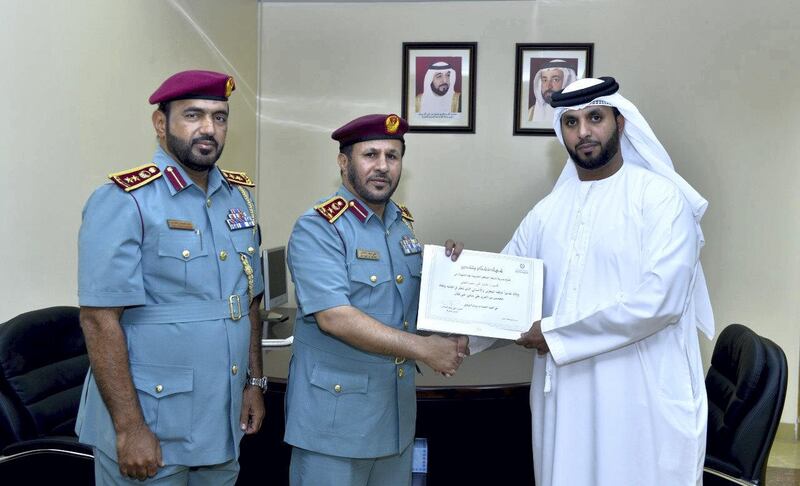 Othman Al Naqbi is congratulated by Sharjah Police after his heroics in rescuing a Filipino couple struggling after falling off a jet-ski. Sharjah Police