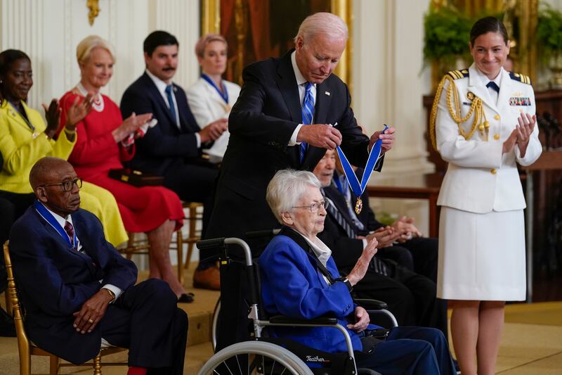 Mr Biden awards retired Brig Gen Wilma Vaught at the White House ceremony. AP
