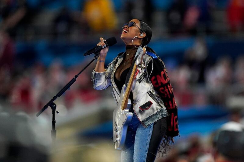 HER performs 'America the Beautiful' before the NFL Super Bowl 55 football game between the Kansas City Chiefs and Tampa Bay Buccaneers. AP