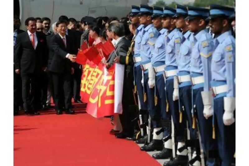 The Chinese minister of public security, Meng Jianzhu (2nd left) walks with the Pakistani interior minister, Rehman Malik, (left) as he meets Chinese officials after Mr Jianzhu arrived in Islamabad last month to hold talks with Pakistani leaders and security officials. AAMIR QURESHI / AFP PHOTO
