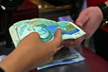 The Iranian economy is exptected to move deeper into recession this year. AFP 