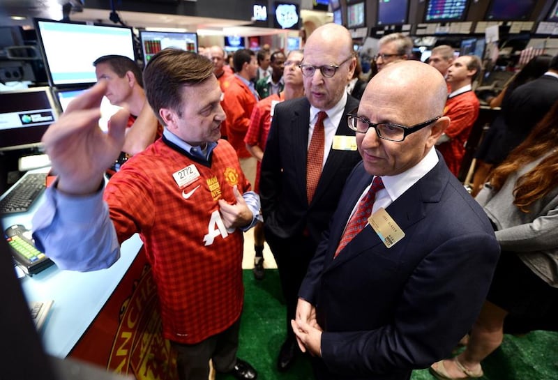 Joel Glazer, right, and Avram Glazer, left, shown during Manchester United's initial public offering on the New York Stock Exchange in 2012. Justin Lane / EPA / August 10, 2012