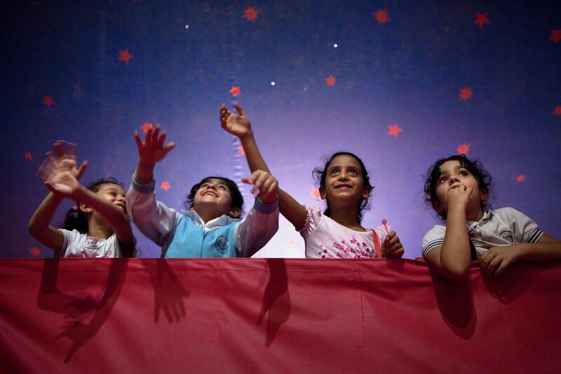 Abu Dhabi, United Arab Emirates, April 29, 2013: 
Emirates Private Schools students cheer on and wave as the performances go on at the Monte Carlo circus on Monday morning, April 29, 2013, at the circus new temporary location in Mussafah, an industrial subsection of Abu Dhabi. 
Silvia Razgova / The National
