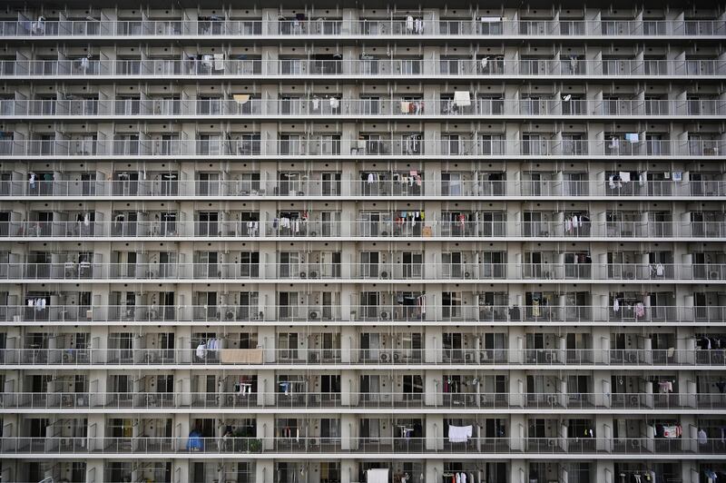 This general view shows a highrise block of flats in Tokyo on April 22, 2019. (Photo by CHARLY TRIBALLEAU / AFP)