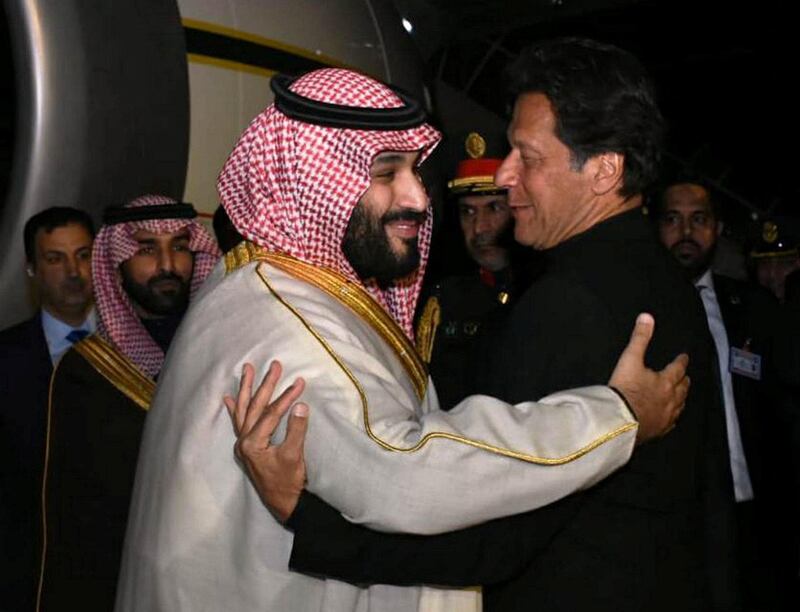 Pakistan's Prime Minister Imran Khan greets Saudi Arabia's Crown Prince Mohammed bin Salman on his arrival at Pakistan Air Force Nur Khan Base in Rawalpindi, Pakistan. Reuters